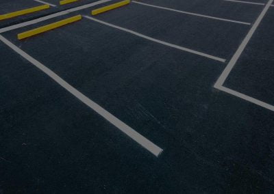 freshly paved parking lot with white lines