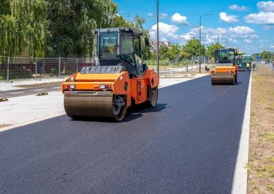 rollers driving down asphalt road